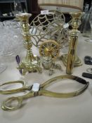 A mixed lot of brass including candle sticks,shell casing,animal studies and more.