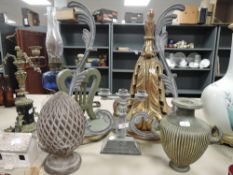 Two decorative carved wall shelves or sconces, a candle stick holder and similar.
