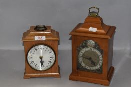 Two small bracket style clocks having wooden cases including Tempus Fugit