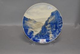 A late Victorian hand painted plate depicting the Isle of Man