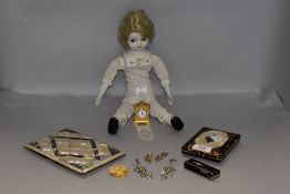 A selection of trinkets and curios including tortoise shell card cases and similar