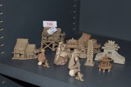 A selection of miniature Chinese figures and model houses possibly by Mud Men Shiwan
