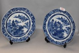 A set of four antique Chinese export hand painted dinner plates in the traditional Willow ware