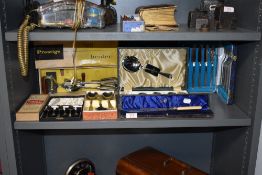 A selection of cased cutlery and serving items including egg beater