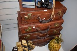 Two set of antique leather suitcases.