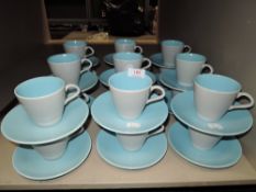 Eighteen Poole cups and saucers in blue and grey colour way.
