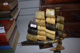 Two vintage Horn ships on wooden bases.