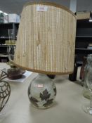 A studio pottery lamp having leaf pattern, shade AF.