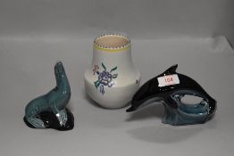 Two Poole pottery figures and a similar Poole vase