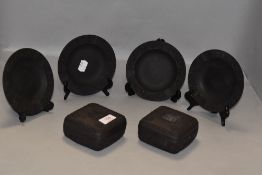 A selection of Wedgwood Jasper wares in a black Basalt ceramic