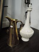A large brass water jug by Sankey and an Italian lamp base