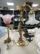 Two brass lamps, one Railway lamp with pink shade having LMR stamped to foot,the other A library