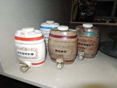 Four Wade receptacles in the form or barrels.
