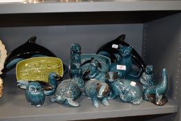 A selection of dolphin blue glaze ceramic figures by Poole pottery