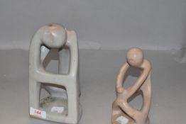 Two hand carved modernist style stone sculptures