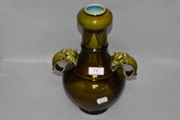 An antique Majolica Sarreguemines vase having gargoyle handles AF converted lamp base