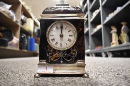 A HM silver framed French bracket clock having turtle shell case possibly made by William Comyns