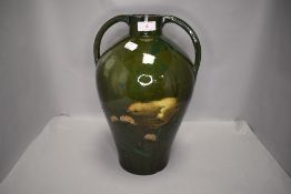 A substantial and impressive arts and crafts era vase decorated with the scene of a chick warning