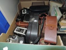 A box full of vintage cameras and similar including Kodak Duaflex II, Brownie junior,Brownie 127 and