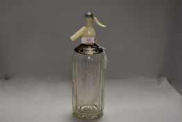 A vintage soda syphon for Schweppes