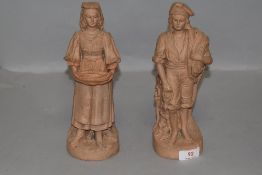 A pair of antique Italian terracotta figures of fisherman and similar impressed JH to base circa