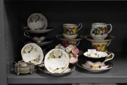 Two tea cup and saucer sets by Queens china