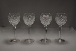 A set of four clear cut crystal wine glasses by Waterford