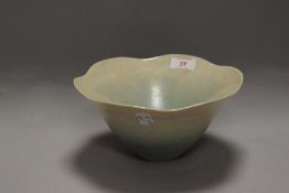 A studio pottery vase by Peter Lane in a lustre glaze with green fade