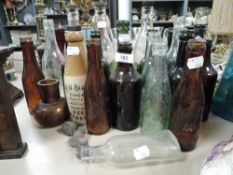 A collection of antique bottles some of local interest including Penrith and Silloth.