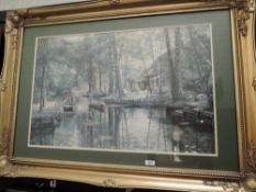 A ornately framed print depicting canal life.