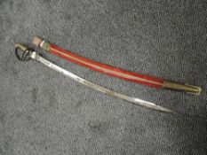 A replica naval style officers sword having Arabic style blade with brass handle and guard