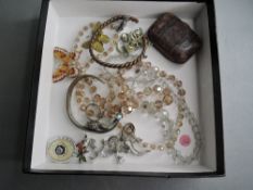 A small selection of costume jewellery including crystal beads, brooches, bangles and small