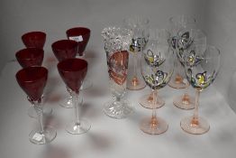 A group of ruby-tinted and other decorative glasswares.