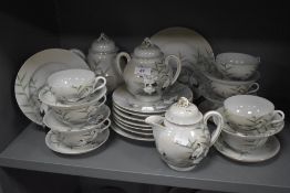 A Chinese eggshell part tea service having crane and bamboo design