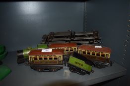 A selection of O gauge train track and carriages.