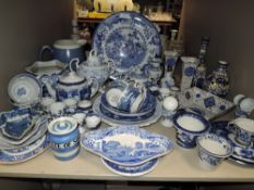A large selection of mixed blue and white wares, willow pattern, Cornish ware etc