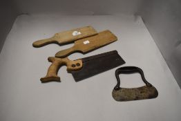 A set of butter pats, a herb chopper and a saw.