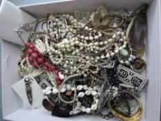 A small jewellery box containing fashion necklaces brooches and bracelet