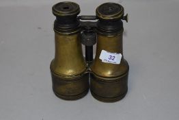 A pair of 19th century continental lacquered brass field glasses