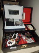 A selection of costume jewellery and collectable coins including enamel badges