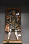 A plaque depicting Henry the eighth.