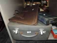 A selection of bags and a small suitcase