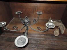 A wrought iron five branch candleabra