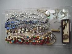 A selection of costume jewellery including pendants, brooches, bracelets etc