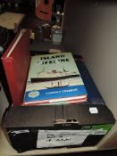 A box of books including vintage Biggles novel and model railway interest.