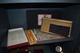 Two vintage board games including Monopoly and Scrabble