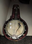 A 20th century resonator banjo in part case needing repairs