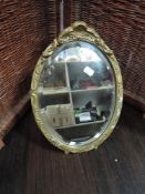 An antique gesso and gilt framed dressing table mirror