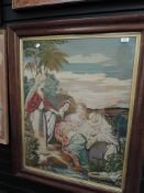 A large framed antique pictorial needlepoint depicting Moses.