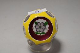 A fine example of Perthshire paper weight having incised windows through white and yellow surround